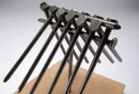 balance several nails on one nail