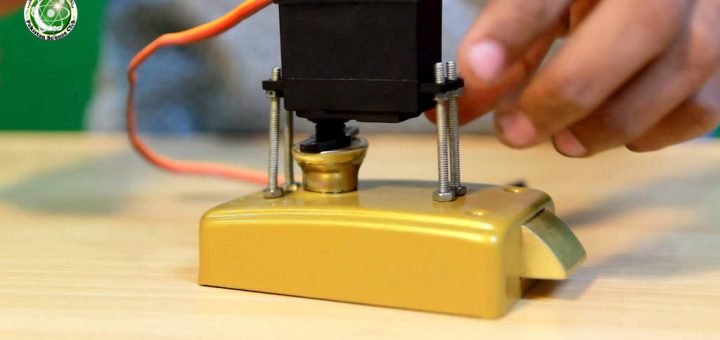 attached servo on lock with nuts and bolt