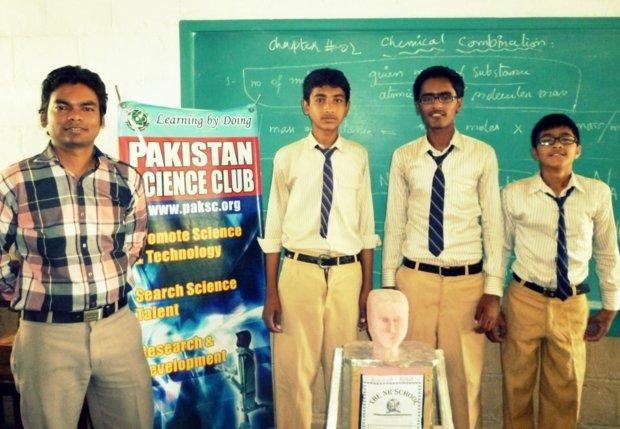 NR school students and teacher with robot