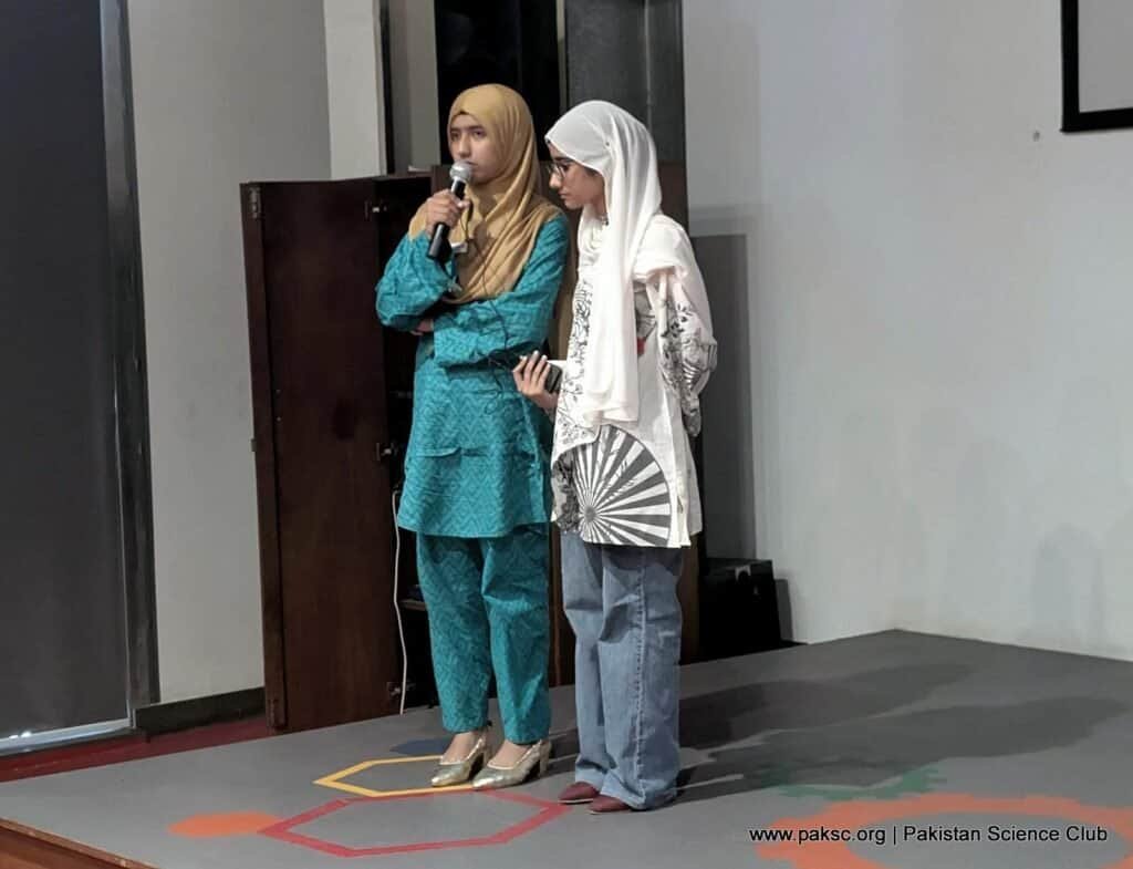 Participant speaking on stage with confidence