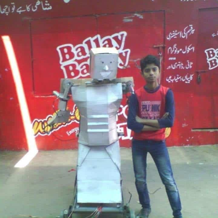 Hamza with his robot made in school